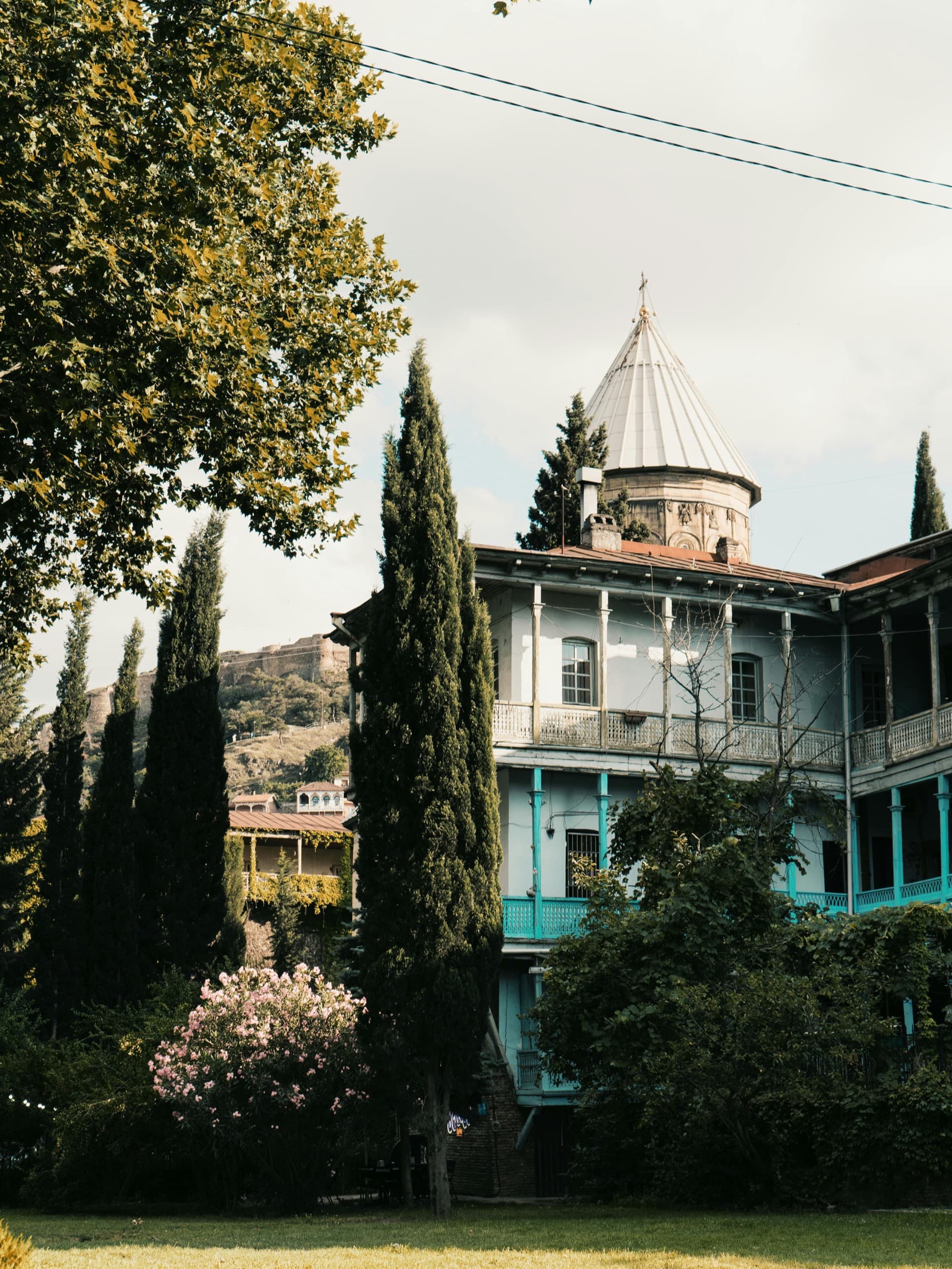 Traditional Georgian wooden balconies with intricate carved details on historic Tbilisi Old Town houses