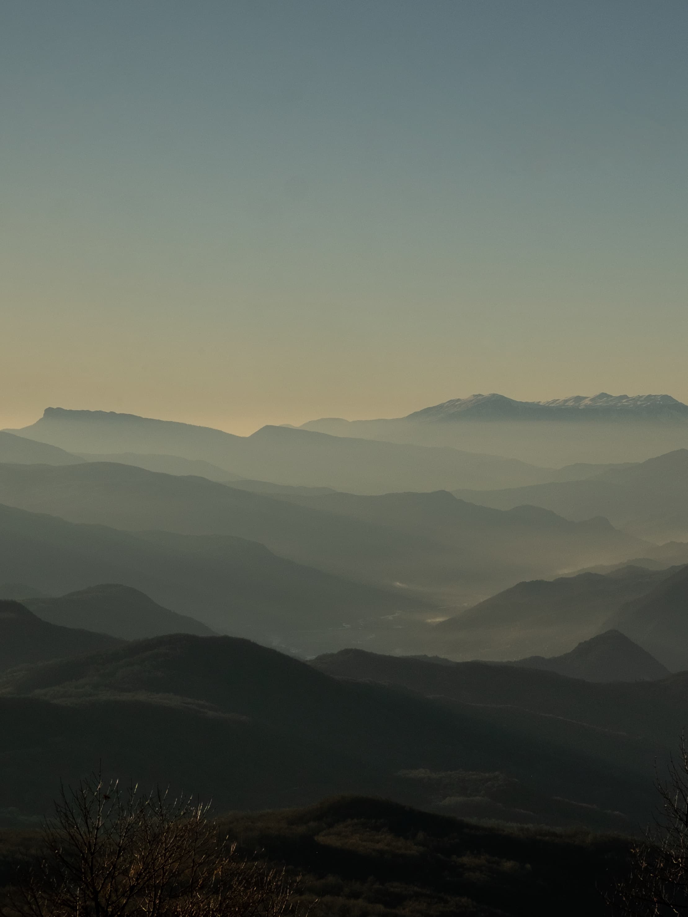 Layered mountain vista with atmospheric perspective from Mravaldzali viewpoint showing Racha region peaks