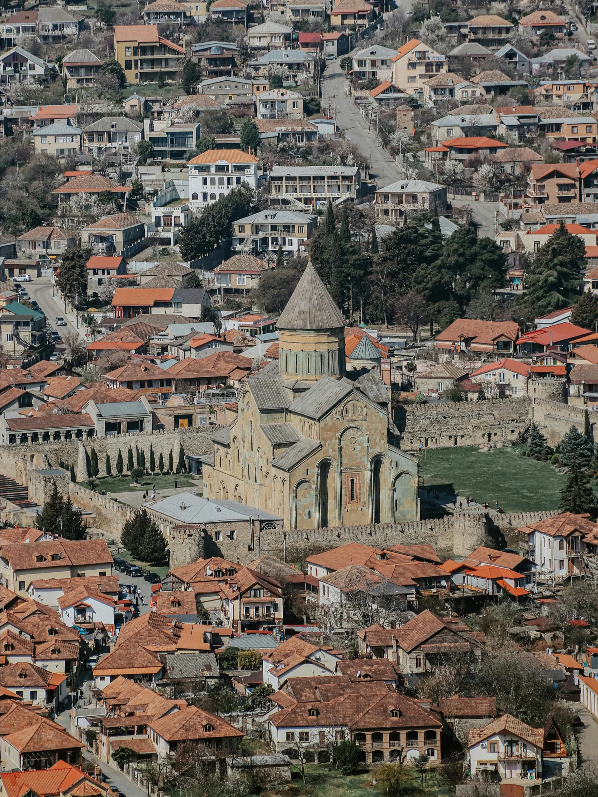 Svetitskhoveli Cathedral in UNESCO-protected Mtskheta surrounded by traditional Georgian houses and ancient walls