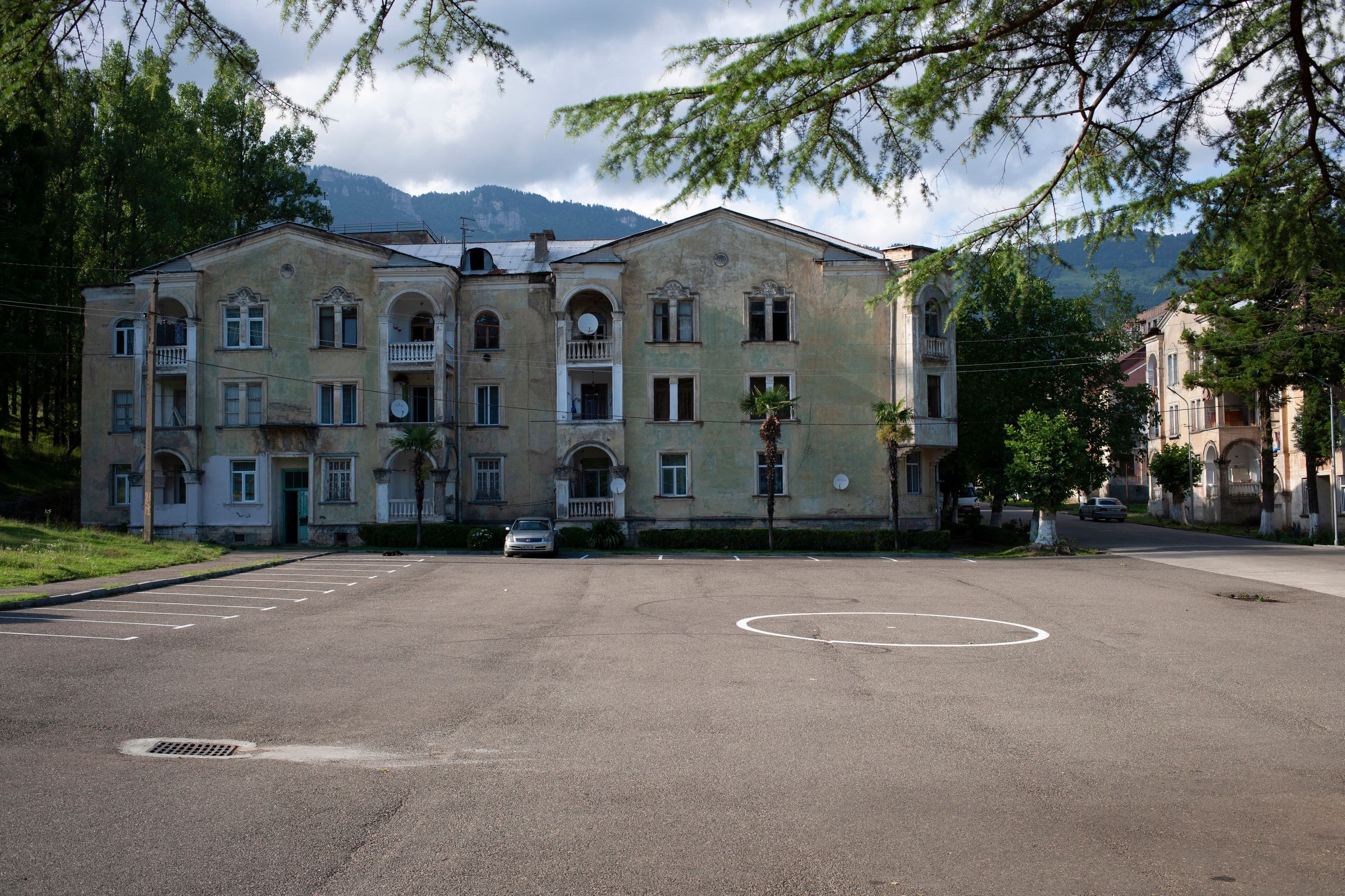 Georgian apartment building with mountains in background