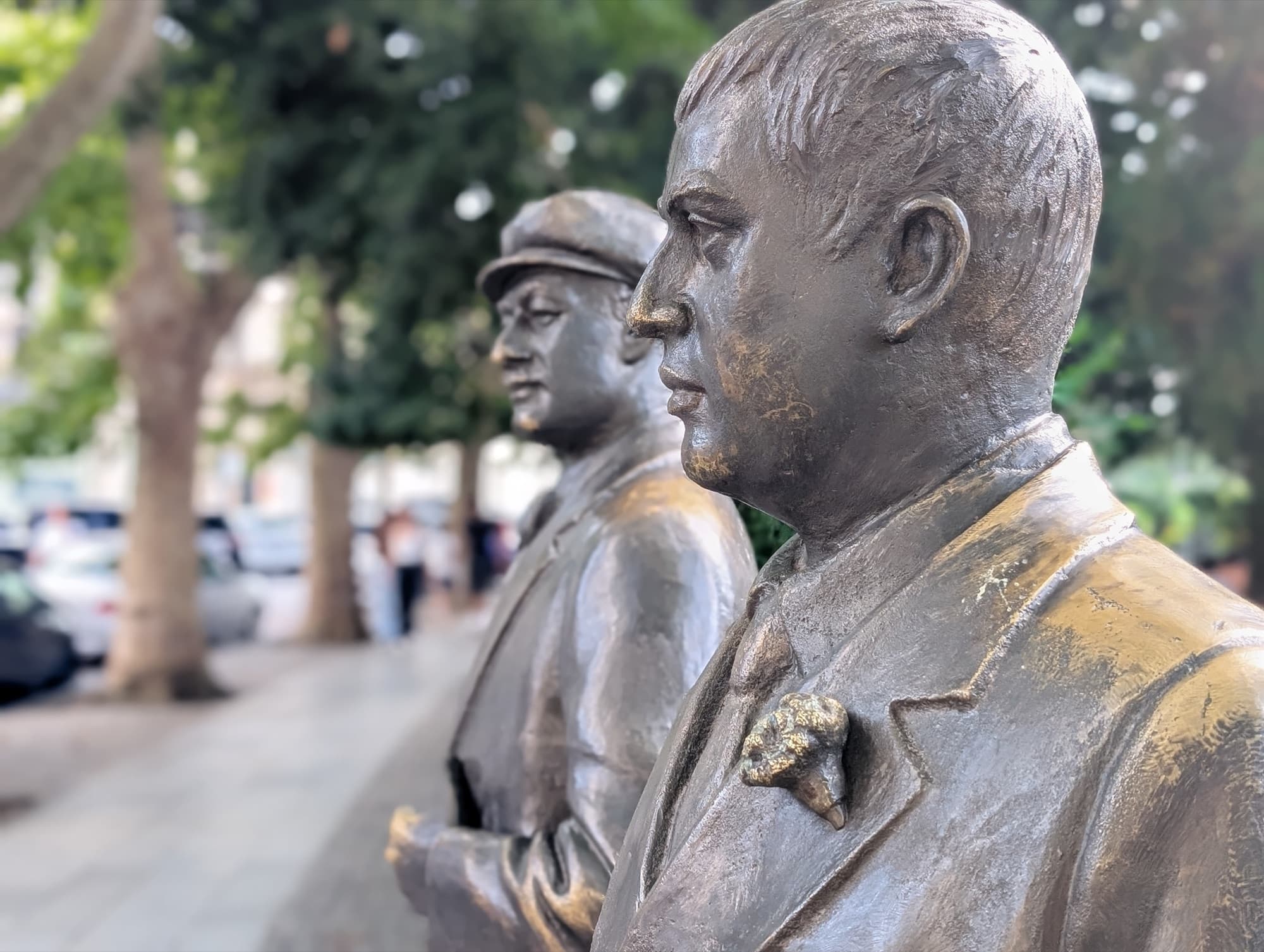 Close-up profile of the bronze statues of poets Titsian Tabidze and Paolo Iashvili in Kutaisi