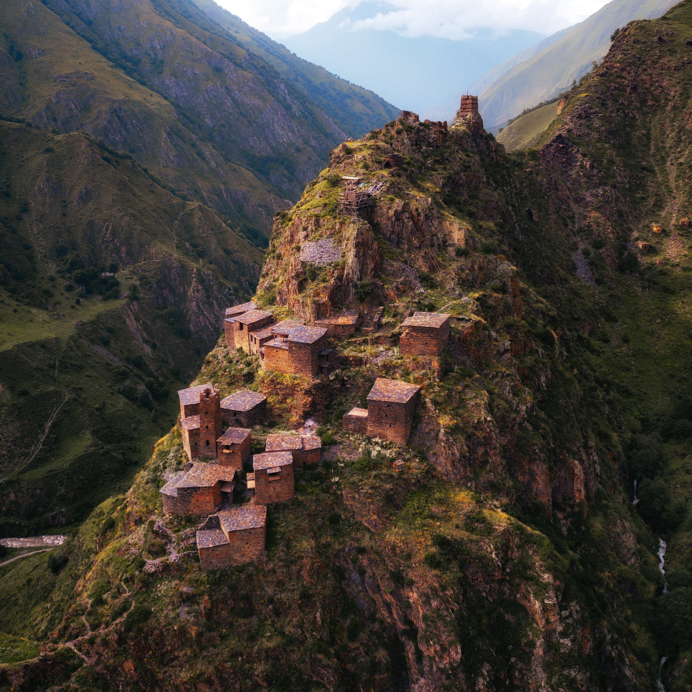 Mutso - Fortress Village Built into the Cliff Aerial view of the medieval fortress-village of Mutso built into a cliff terrace in Khevsureti, Georgia